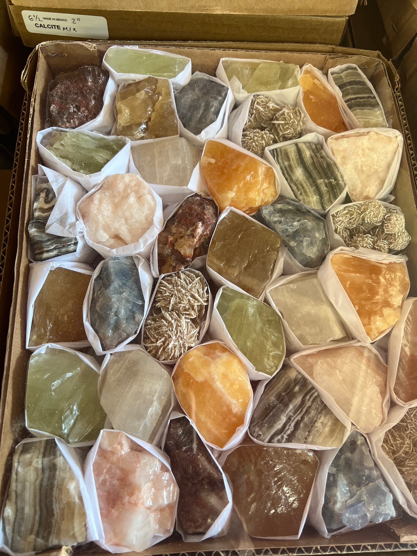 Natural Color Mixed Calcites /Orange Calcite mixed minerals / multi color box Take a little bit of Mexico !Extremely cute Rough Raw mixed mineral flats. Each flat comes with Each flat has a different variety of stones on them. Approximately 45-50 pcs per