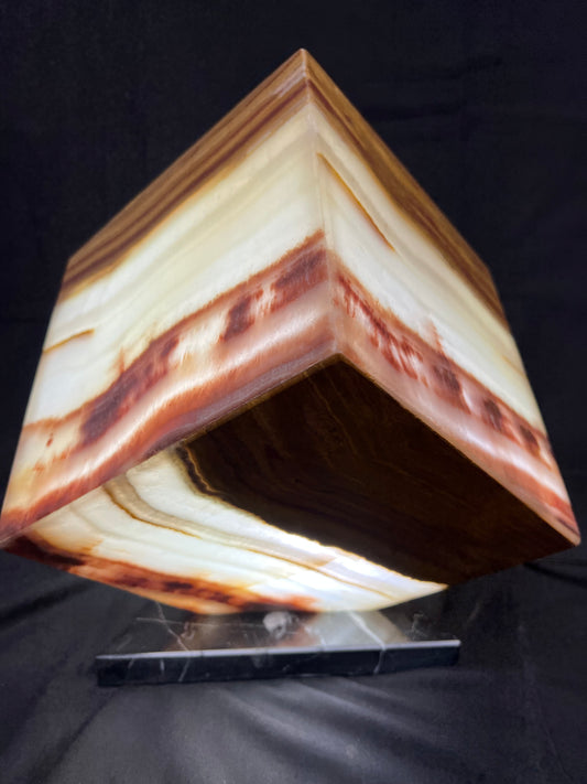 Cubed Shaped Onyx Lamp. Colors Yellow with Brown . Size 8X8X8 inches. Each has different layers and color veins .